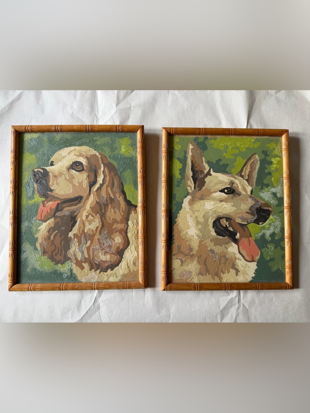 Vintage pair of paint by number dog paintings
